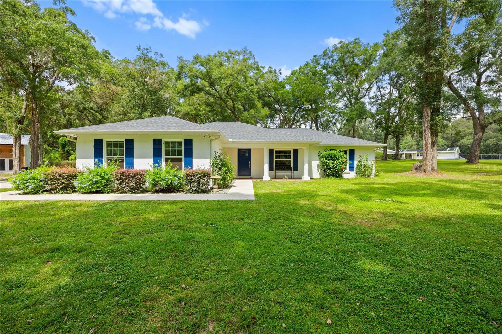Situated on just over 2.5 acres in the heart of Ocala, this 3-bedroom, 3-bath home offers privacy, space, and flexibility. The open split-floor plan features a spacious family room, quartz kitchen counters with a marble backsplash, and luxury vinyl flooring throughout. The primary bath and one guest bath showcase marble mosaic herringbone shower floors, bringing a refined touch of elegance.
Outside, the fully fenced property is both private and functional. A 36’x24’ pole barn with an enclosed, A/C-cooled flex space makes the perfect workshop, studio, or home office. Perfect for hobby farms or equestrian enthusiasts, the home is just 2 miles from the Florida Horse Park and 17 miles from the World Equestrian Center. For hikers and mountain bikers, Santos Trails are only 5 miles away—making this location a true haven for outdoor living. With ample room to spread out and a prime Ocala address, this property is ready for its next owner.
Schedule your showing today!