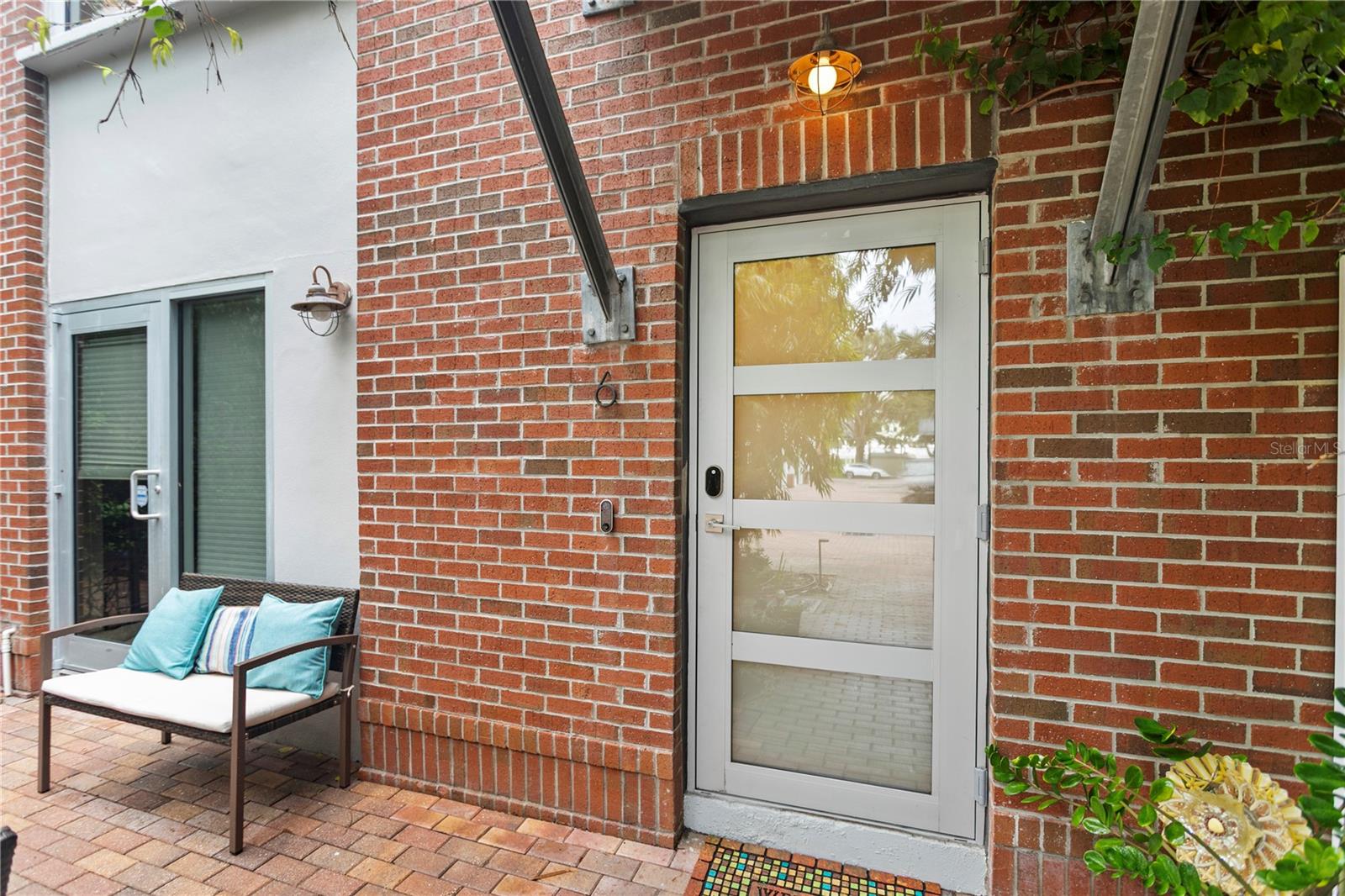SELLER CREDIT $15,000 FOR CLOSING COSTS OR RATE BUY DOWN. Move-in ready 3BR 3.5BA townhome in downtown St. Pete’s waterfront arts district offering the perfect mix of urban energy and peaceful community living just steps from USFSP and the bay. This home features three true bedrooms with full privacy an updated layout with surround sound a large kitchen with extra storage and a flexible front suite ideal for guests a home office or rental income. Enjoy a spacious two-car garage with workshop space a low-maintenance front patio and a south-facing design that minimizes heat while offering storm protection and superior durability. Includes an 8kW solar system to offset energy costs. Located on a quiet tree-lined street with protected views and easy access to Publix the Grand Prix Saturday market and I-175. Low $290 monthly HOA. Rare opportunity to own a well-built energy-efficient and versatile home in one of St. Pete’s best-kept secret communities.