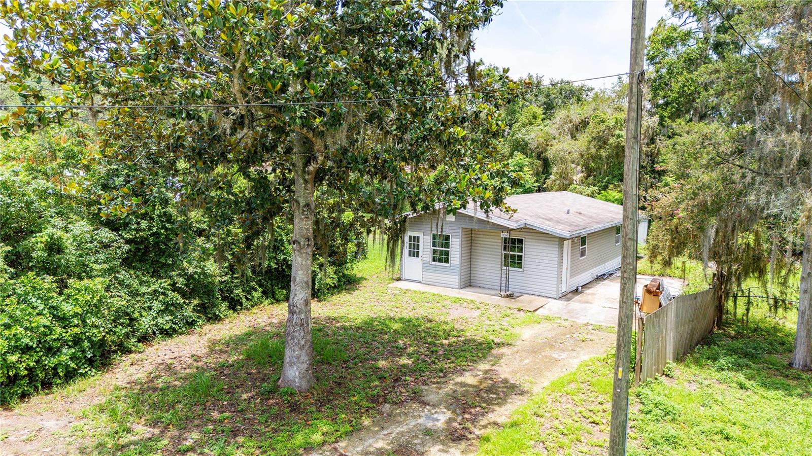 1968 precious home in Lake Panasoffkee. Own your own place without spending a ton!!! This home has already had a ton of upgrades completed. All it needs are a few final touches.
2 bedrooms and 1 bathroom with a large living space and a cozy kitchen. There is a concrete pad for parking and a well house in the back of the property. Utility room inside has laundry hookups so you cab have your laundry space inside the home. This place has a ton of potential! The work has been started so you can still personalize the space to your liking.