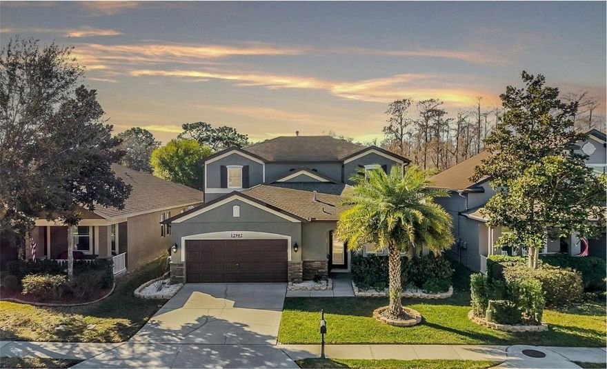 Tucked away on a peaceful lot in the gated community of Trinity East, this beauty truly checks all the boxes. Every square inch of this home has been updated ROOF IS ONLY A WEEK OLD;  NEW AC/FURNACE; SALT SYSTEM FOR POOL 2024. With low HOA dues and zoning for top-rated schools, it’s easy to see why this neighborhood is so highly sought-after. Step inside and you’ll immediately notice the thoughtful upgrades and timeless finishes throughout. Hardwood stairs with custom elegant wrought iron railings lead to a versatile loft—perfect as a home office, playroom, or second living space—complete with a convenient Jack and Jill bath. Crown molding adds classic charm, while the spacious primary suite offers a custom-designed closet you’ll absolutely love. The main living areas feature easy-care wood-look tile, and there’s not a trace of carpet anywhere—only quality finishes like porcelain wood like tile, and marble. The fully updated kitchen shines with granite countertops and brand-new stainless steel appliances, making it as functional as it is beautiful. Every bathroom has been tastefully updated, and modern touches like Nest Wi-Fi temperature control, LED lighting throughout, new double-hung Low-E windows, and four sleek smart fans bring comfort and efficiency to the forefront. Replaced smoke and CO detectors 3 yrs ago that are hard wired and have 10yr backup battery for peace of mind. The exterior was freshly painted in 2024, giving this home standout curb appeal. Out back, your private oasis awaits. The saltwater pool is surrounded by custom landscaping, decorative pavers, Wi-Fi/smart landscape lighting, and a smart sprinkler timer system—perfect for entertaining or simply unwinding at the end of the day. All of this in the coveted Trinity area, just minutes from great schools, shopping, the airport, and Florida’s beautiful beaches. This one feels like home the moment you walk in.