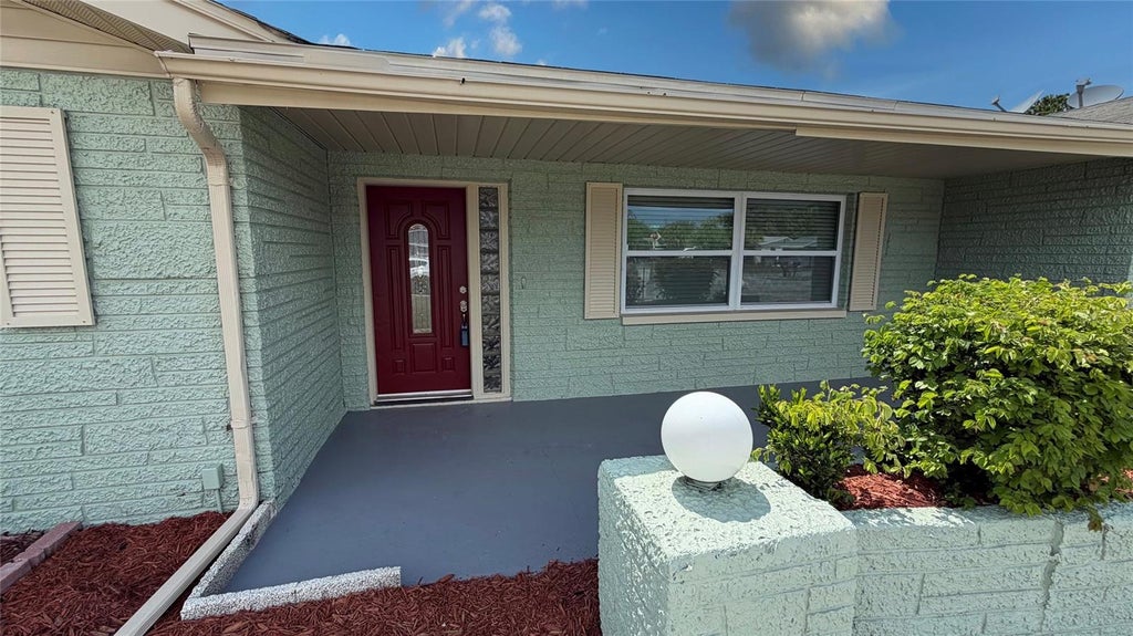 Photo of 10925 Piccadilly Road, Port Richey, FL 34668 (MLS # TB8518096)