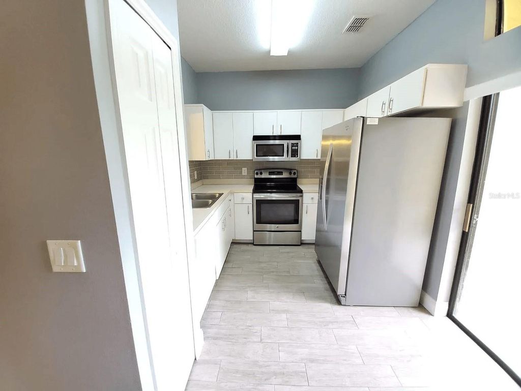 Photo of 6037 Scotchwood Glen #4, Orlando, FL 32822 (MLS # O6365998)