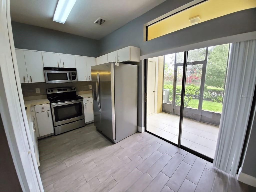 Photo of 6037 Scotchwood Glen #4, Orlando, FL 32822 (MLS # O6365998)