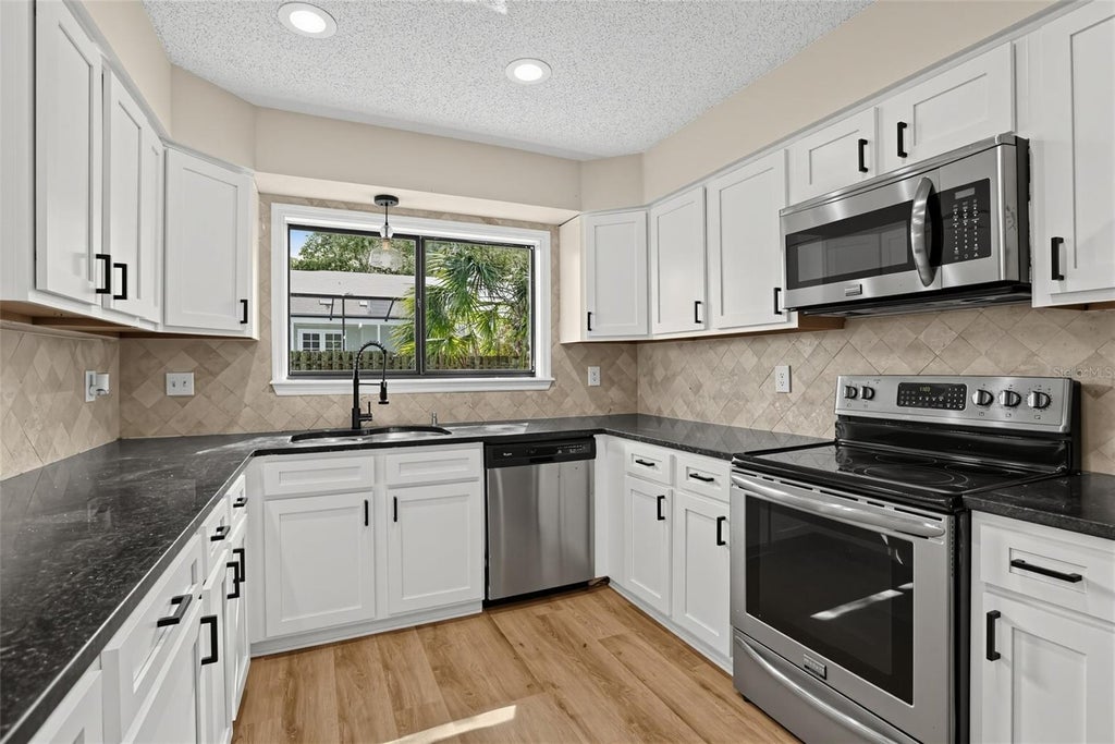 Photo of 1539 Grace Lake Circle, Longwood, FL 32750 (MLS # TB8545665)