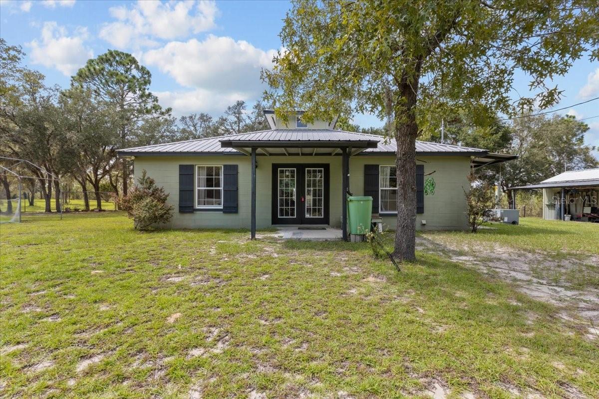 Wonderful 2 bedroom/1 bath custom home located on 9.18 acres in gorgeous Archer Florida. This property is a dream, beautiful rolling hills , open pasture , completely fenced and cross fenced perfect for the horses or farm animals. As you drive up to the property you see the cozy home sitting perfectly , a nice drive and gorgeous view across the pasture. As you enter the home you will fall in love with its uniqueness and charm . Original parquet flooring throughout in excellent condition , a nice foyer opening up the bright open floor plan with the open kitchen and open living room and exit doors onto the back screened porch. Bedrooms on spacious and share a bathroom with a combo tub/shower. Laundry room offers extra space for storage and an exit door as well. In the center of the home you get to enjoy natural light with the custom ceiling detail. Outside you have wide open space to put your own personal touch on it! Cross Fencing around the home perfect for pets . A nice outbuilding that can be used as a workshop and the lean too to park the mower or tractor. The property is surrounded by Goethe State Park ensuring ultimate privacy and seclusion! This home is a MUST SEE , accepting ALL loans , call today for YOUR tour!