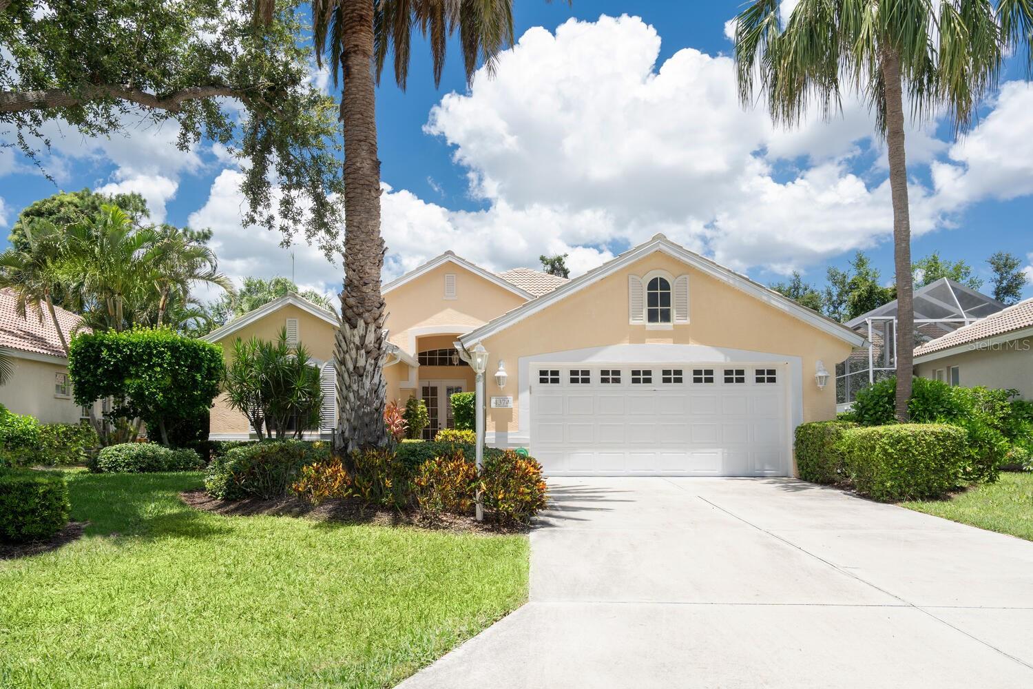 LOCATION LOCATION LOCATION! We've all heard the timeless expression, but not all homes meet the standard. This beautiful home most certainly does! Found in the sought after neighborhood of The Greens at El Conquistador - a tucked away, intimate sized subdivision of only 43 classically designed homes with a Southern Mediterranean flair encompassed by preserves, lakes & the IMG golf course. The ease and freedom of a single family home with superior quality concrete block construction and the desirability of maintenance free yard care - perfect for a second home or those on the go! This customized home enjoys an ideal floorplan with the spaciousness of approximately 2300 square feet along with the comfortable flow of an open Great Room concept featuring soaring, volume ceilings with abundance of recessed lighting, decorative moldings, fireplace and tile floors on the diagonal. Ten foot sliders pocket for wide expanse out to the private screened pool and patio with cabana bath and deep preserve back-drop. The large, thoughtfully designed kitchen features center island with vegetable sink and an excellent layout of cabinetry with built-in appliances and extra oven. Delightful breakfast area has bay window with window seat, built-in desk and there is the convenient access from garage for bringing in groceries. Three bedrooms, smartly laid out with pocket door entry to second and third bedrooms and a grand owner's retreat with tray ceiling & huge walk-in master closet. Lovely master bath with dual sinks, garden tub with separate shower & private water closet with bidet. A/C system replaced December 2024. Super neat, brand new electric storm shutter at front entrance and new storm screens for front windows scheduled for August. Nice size interior laundry room. Also to be appreciated is the extended length of the garage to fit larger vehicles. Family and pet friendly atmosphere with sidewalks and graceful, mature landscaping. By way of a short golf cart drive, Greens residents can partake of the semi-private IMG Golf and Country Club with its championship course & Sarasota Bayfront dining. Near all conveniences with close proximity to renown IMG Academy and just 20 minutes to fun Anna Maria Island with its wonderful Gulf beaches plus the same short distance to the cultural arts and buzz of downtown Sarasota. Florida living to be cherished for the fortunate Buyer that does not delay!