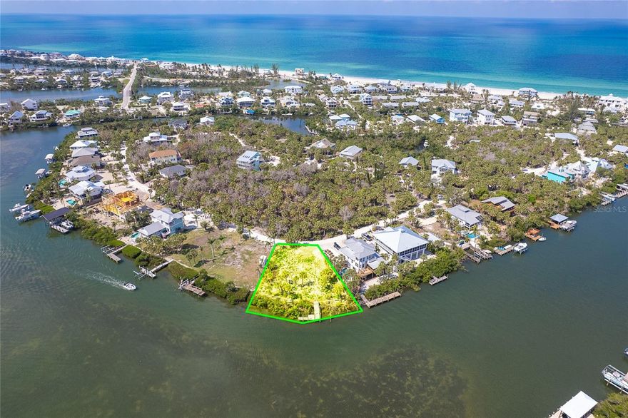 Prime lot 1 minute from the ICW with expansive views of Lemon Bay and the ICW.  House plans are available, as well as a soil test and survey.  The dock is in the process of being repaired from storm damage.  Build your dream home and live the island lifestyle.  There is boating, fishing kayaking, paddle boarding, strolling the beach for shells and shark's teeth and enjoying the peaceful nature and glorious sunsets.  Don Pedro-Knight-Palm Island is a bridgeless, barrier island situated between Sarasota/Tampa to the north and Ft. Myers/Naples to the south.  Accessible only via private boat or a 4 minute car passenger ferry.