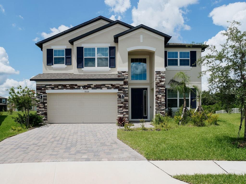 Welcome to your dream home in the highly sought-after Cobblestone subdivision of Zephyrhills, FL! Built in 2024, this beautifully designed 5-bedroom, 4-bathroom residence offers an impressive 3,761 square feet of modern living space on a quiet cul-de-sac—perfect for families seeking space, comfort, and privacy. Step inside to find an open-concept kitchen ideal for entertaining, complete with contemporary finishes and ample counter space. The generously sized bedrooms provide comfort for everyone, while the 4 bathrooms ensure convenience for larger households or guests. A 2-car garage offers secure parking and additional storage. With its thoughtful layout and modern construction, this home delivers both functionality and style. Community features a pool area and playground for entertaining! Don’t miss your chance to own this stunning new build in a peaceful, family-friendly neighborhood. Schedule your private showing today!