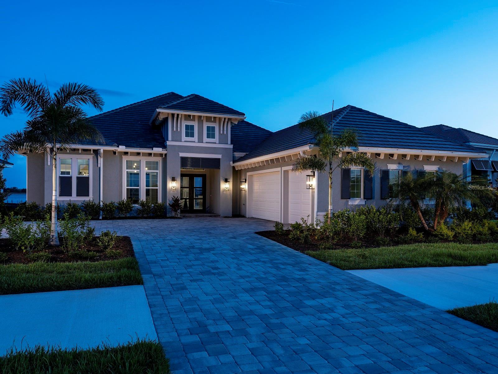 Welcome to Wild Blue at Waterside, where luxury coastal living meets natural beauty. Stock Luxury Homes presents an exquisite blend of timeless architecture, semi-custom details, and expansive open spaces. This stunning MODEL HOME features 3 bedrooms, 4.5 bathrooms, a spacious Great Room, elegant Dining Room, a dedicated Study, and 3 car garage. Enjoy seamless indoor-outdoor living with a dynamic outdoor space complete with a pool, spa, outdoor kitchen and fireplace. This MODEL HOME is being sold with leaseback terms through February of next year. This Quick Close Sales Price includes the furniture and decor package!