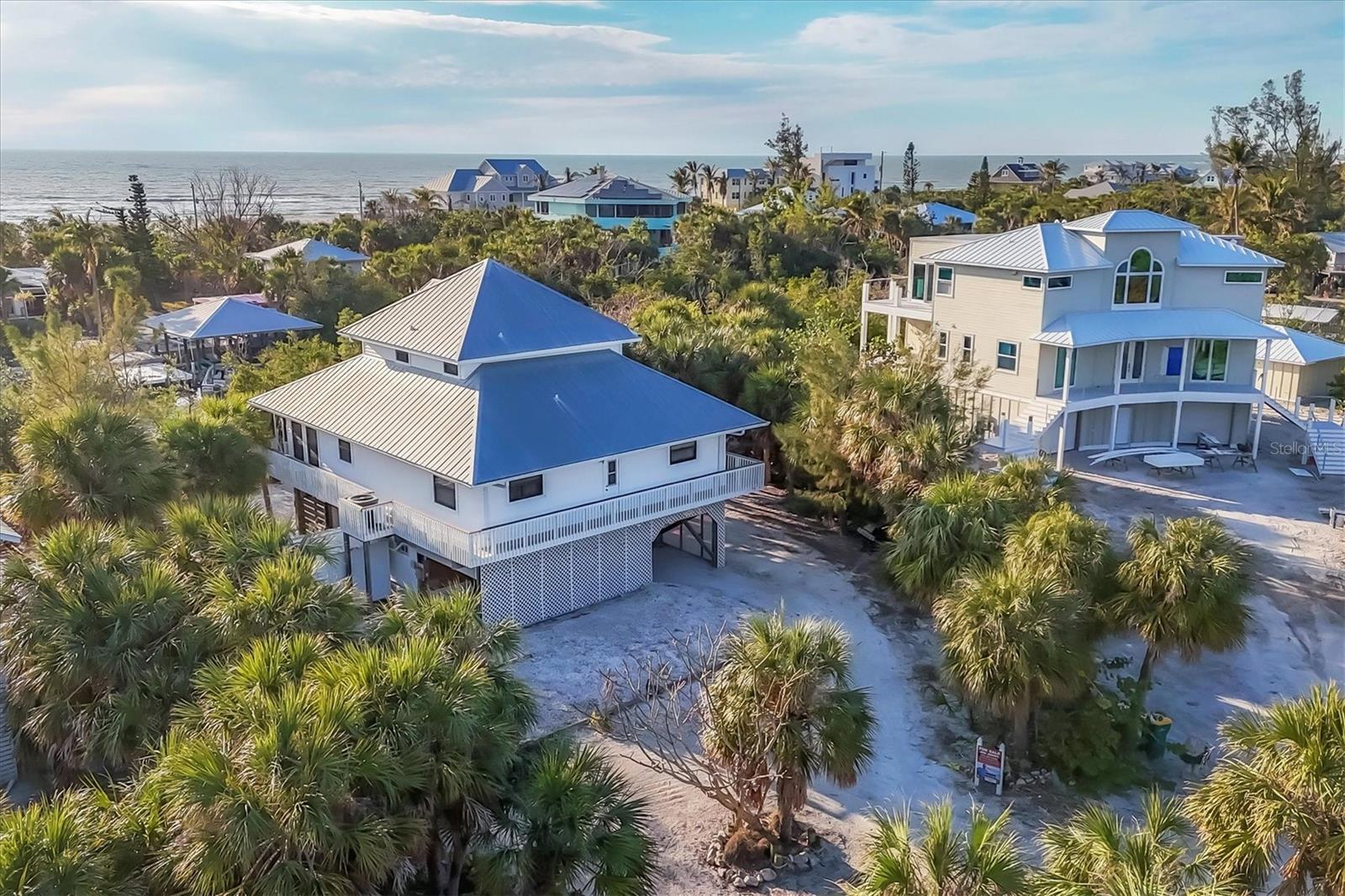 Welcome to your dream island! Escape to the serene charm of Palm Island! If you're dreaming of a peaceful retreat, this is the perfect haven. Nestled on Palm Island, a picturesque barrier island in Southwest Florida accessible by car ferry or boat, this charming 3-bedroom, 2 -bathroom home offers the quintessential island lifestyle.
Bask in sun-drenched, leisurely days by the Gulf, enjoy fresh catches right off the dock, and wander along the pristine white sand beaches that Palm Island is celebrated for. A walk to the beach will bring you to mesmerizing sunsets and delightful shelling experiences.
The home's inviting backyard is an ideal setting for outdoor gatherings-complete with a screened porch for those breezy evenings and an open deck with ample seating where you'll likely spend most of your time enjoying the outdoors.
You'll find yourself mere minutes from the Gulf of Mexico's sparkling blue-green waters. Embrace every moment and indulge in all that this enchanting island has to offer.