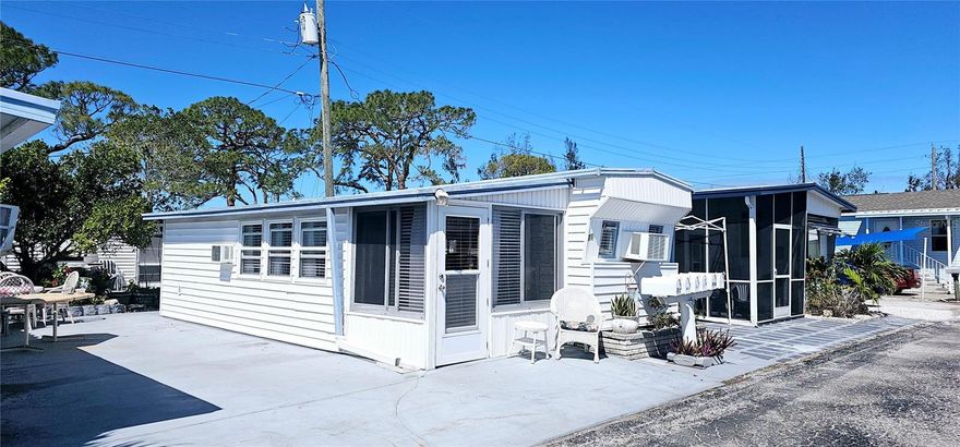 Paradise Bay Estates offering: Welcome to your slice of Florida paradise in the sought-after Paradise Bay Estates! This charming 1BR/1BA home is perfectly situated in a vibrant +55 waterfront community with direct access to Sarasota Bay and just minutes from the pristine beaches of Anna Maria Island. The furnished residence features a recently updated kitchen with new base cabinetry, plus the convenience of a full-size washer and dryer in the shed. An expanded concrete parking area provides ample space for vehicles, golf carts, or bikes—ideal for the active coastal lifestyle. Paradise Bay Estates offers an unbeatable social calendar and amenities package, including a heated pool, hot tub, shuffleboard, and pickleball courts. The clubhouse is alive with activity, hosting shows, potlucks, bingo nights, and special events, while numerous clubs provide opportunities for golfing, kayaking, and organized bus trips. Nestled along the serene shores of Sarasota Bay, the community also boasts a private boat ramp and picturesque waterfront gazebos, the perfect spot to watch breathtaking sunsets night after night. Don’t miss this opportunity to enjoy the best of coastal living in a friendly, active community!