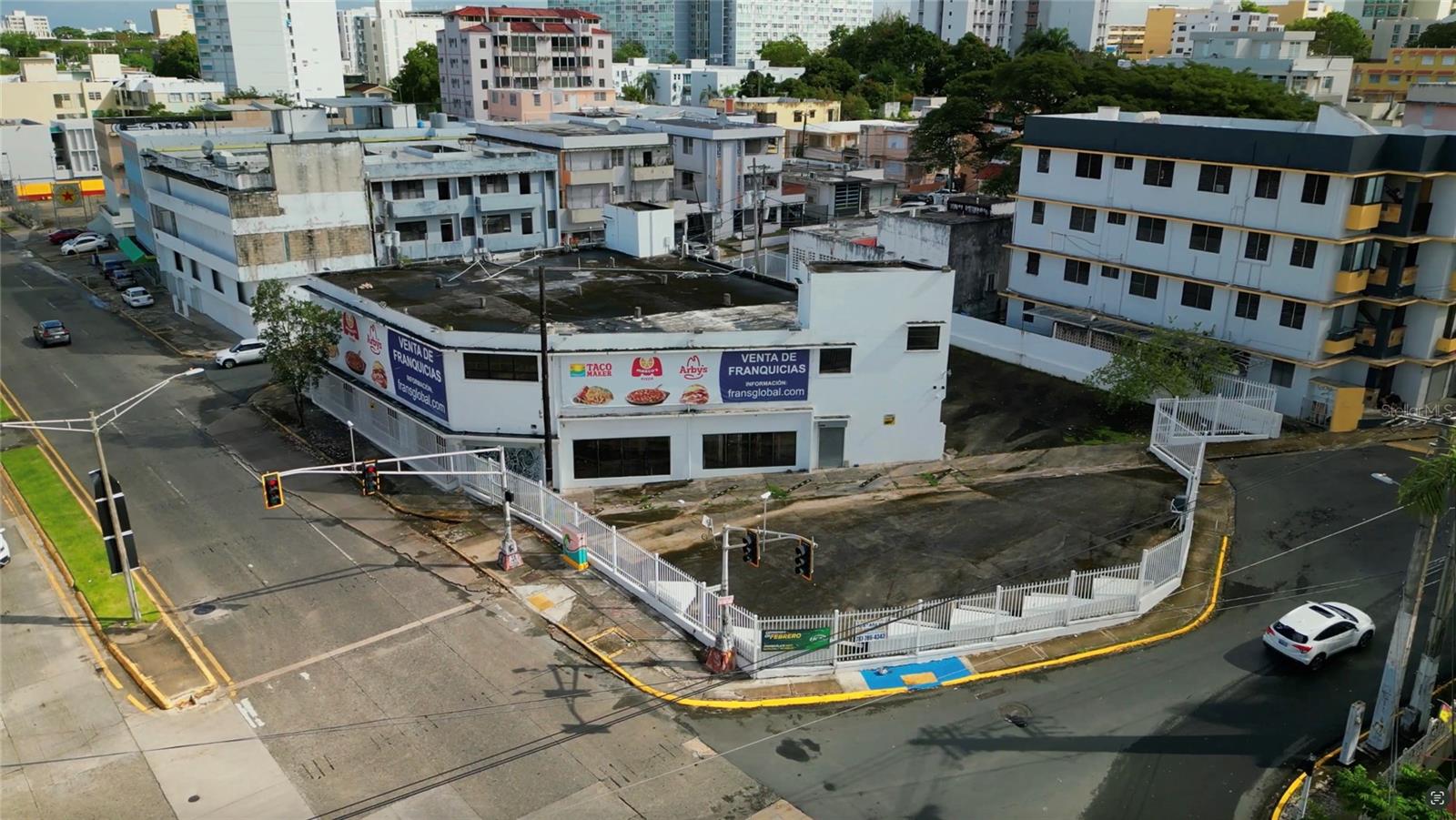 Seize this prime investment in RÃo Piedras’ revitalization! This 12,271 sq. ft., two-story corner commercial office building sits on a 17,254 sq. ft. lot (1,603 sq m) at #881 Avenida Muñoz Rivera, offering high visibility, three entrances, and 30+ parking spaces. Zoned CT-2 (Commercial Tourist Intermediate), it features two gated entrances, two generators (100 kVA & 150 kVA), a 2,500-gallon diesel tank, and an asbestos-free certification. Conveniently located near the VA Hospital, University of Puerto Rico, Auxilio Mutuo Hospital, and San Juan Judicial Center, it's ideal for corporate offices, retail, a hotel, or institutional use. Positioned in a San Juan Development Zone, it qualifies for Emprendimiento Capital, a program offering property and business tax exemptions. Contact us today to learn more or schedule a tour!