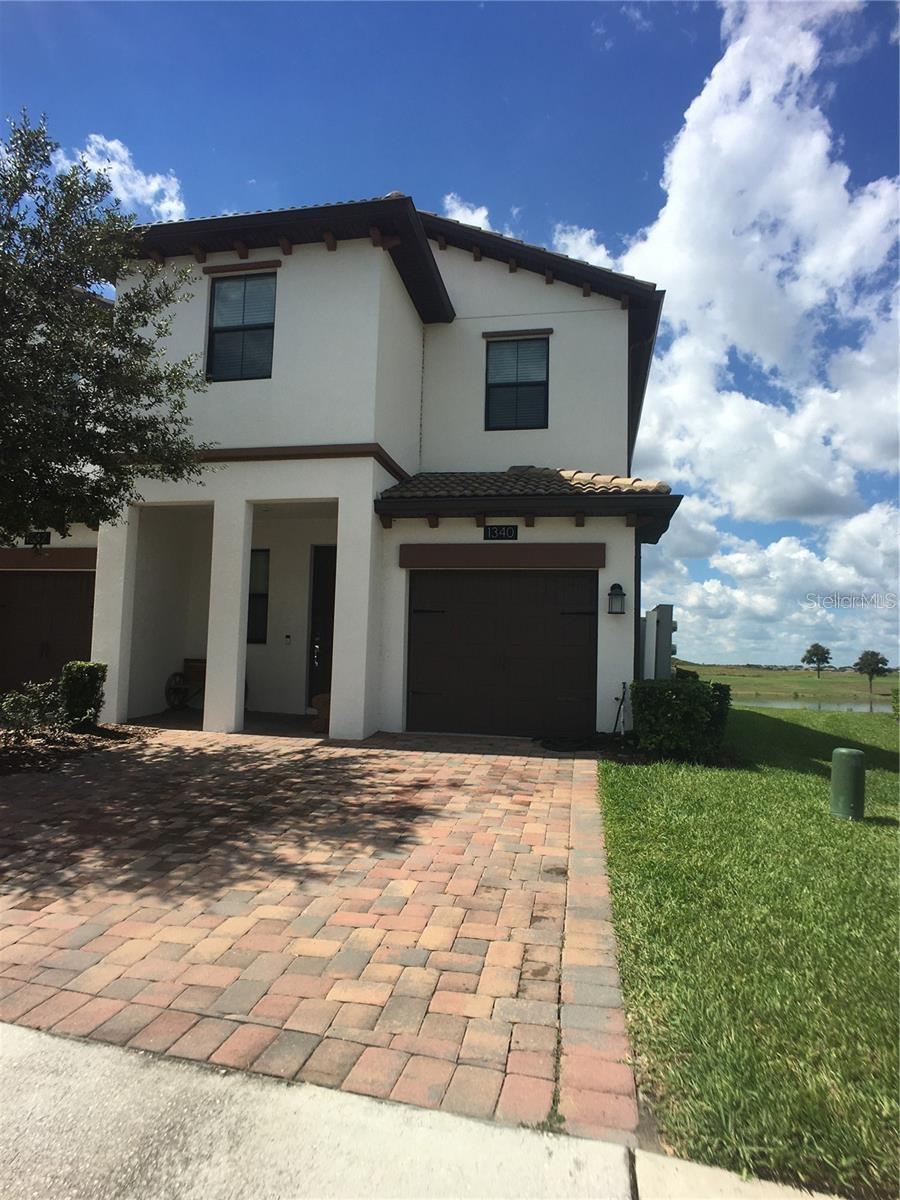 This 3 bedroom 2/1 bathroom townhome is available for rent! It is an end unit and has a lovely pond view in the backyard. Sitting in the Vistas section of Champions Gate, the unit features wood look tile downstairs, granite countertops, ceiling fans throughout, and a full sized washer and dryer. There is a one car garage attached to the unit. Valet trash service is included in the rent, as well as basic cable and internet. The community also has a pool, a fitness room, game room, and other amenities for the tenants to enjoy. You also have access to the Oasis Clubhouse, which has a lazy river, water-slides, swim-up bar, spa, restaurant, and much more. There are many local shops and restaurants to enjoy nearby, and you have quick access to I-4 for travel. The HOA has a 30-40 day approval process for leases. This property is tenant occupied until early November, appointments are required.