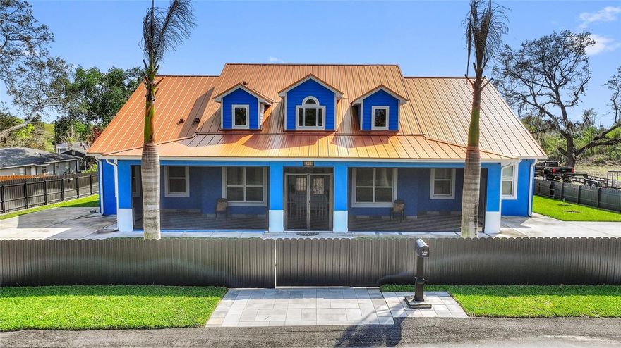 Welcome to 803 N 24th Street. A custom built home with all of the upgrades you can imagine. Arriving you will enter through a motorized gate that surrounds the entire lot. It is your choice to park in front of the home, in the rear or inside the two-car garage. An oversized covered screened porch on both the front and back of the home. As you enter through the front door you will be greeted by 14-foot ceilings throughout the home and the perfect temperature as the home has spray foam insulation in the entire house. After the grand entry is the open concept kitchen and living room. The kitchen is fitted with all Kitchen Aid appliances and the hood is vented outside. There is a large walk-in pantry and room for plenty of barstools and a table for eating. The primary bedroom is just behind the living room with a grand hall to the primary bathroom including two separate vanities, walkthrough shower, soaking tub and toilet room. Two large walk in closets with custom cabinetry complete the primary suite. Across the house are bedrooms two and three with a jack and jill bathroom. Then a laundry room with ample counter space for folding and plenty of storage. The property also has a large private office and bonus space which is currently used as a gym. The fourth bedroom has its own on suite full bathroom. The property has two Carrier air conditioning units. There is a shed in the backyard. Located just a block away from Haines City Soccer Complex and Larry Parrish Baseball Complex. This property has everything you dreamed of ready for you to move in. Come see this gem today.