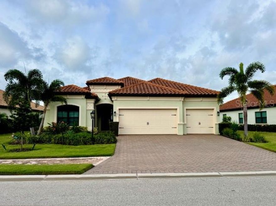 Set within the renowned gated community of Country Club East in Lakewood Ranch, this stunning lakefront home embodies style, comfort, and the essence of Florida’s resort-inspired lifestyle.

Positioned on a premium waterfront lot, the Princeton model delivers sweeping lake views and offers 4 bedrooms (with the 3rd bedroom also ideal as a den), 2 baths, and a sparkling pool and spa. The design emphasizes effortless indoor-outdoor living, perfect for both relaxation and entertaining.

Interior Features

Inside, the open-concept floor plan invites natural light and connection between spaces. The gourmet kitchen boasts:

A modern floating island with seating

Sleek quartz counters

Soft-close cabinetry with pull-out storage

42” upper cabinets

Stainless steel appliances with a gas cooktop

A cozy breakfast nook overlooking the water

The dining area is framed by a distinctive arched opening to the gathering room, adding elegance and character. Bright wood-look tile floors extend throughout, paired with a contemporary backsplash for a polished yet welcoming feel.

Outdoor Living

Triple glass sliders open to an expansive lanai—one of the largest designs by WCI in this community. The custom outdoor kitchen includes a built-in grill, granite counters, refrigerator, vent hood, and stone accent wall. A spacious paver deck surrounds the pool and spa, offering multiple spots to lounge or dine while enjoying panoramic lake views.

Additional Highlights

Oversized 3-car garage

Abundant natural light

Refined finishes throughout

Lifestyle & Location

Residents of Country Club East enjoy three resort-style pools, a fitness center, and clubhouse, with the option to join Lakewood Ranch Golf & Country Club for access to golf, tennis, pickleball, aquatics, fine dining, and vibrant social events.

Ideally located minutes from Waterside Place, Lakewood Ranch Main Street, and UTC Mall, the home also provides easy access to top-rated schools, shopping, healthcare, and Sarasota’s renowned cultural venues and Gulf beaches.

? A true lifestyle opportunity, this home offers the perfect blend of sophistication, comfort, and the best of Florida living.