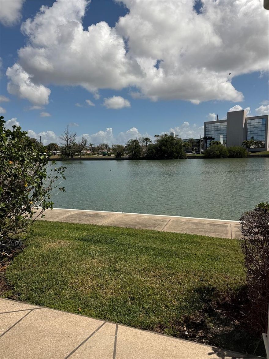 Enjoy the carefree Florida lifestyle in this newly renovated 2 bed, 2 bath water front first floor condo. All appliances are new  with warranties, water heater is new. Brand new impact doors and windows for peace of mind. The covered parking space is just feet from the front door. All new carports will be installed soon. There are separate men's and women's gyms, a sea wall that spans the perimeter of the property, 6 heated pools, 4 lighted tennis courts and a club house with a brand new commercial kitchen. Come and see all that this active 55 plus community has to offer.