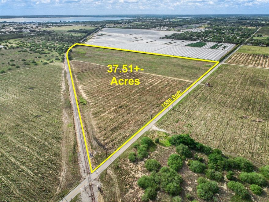 This 37.51-acre parcel is located less than 1/4 mile from US Hwy 27 in central Sebring. It offers 1,538 feet of road frontage and about 1/2 mile of railroad frontage. The property includes three wells—one 6" and two 4". Zoned Agricultural, it's suitable for uses like a nursery, bamboo, tree farm, hay, or citrus. Rezoning for Commercial, Industrial, or Residential use may be possible.