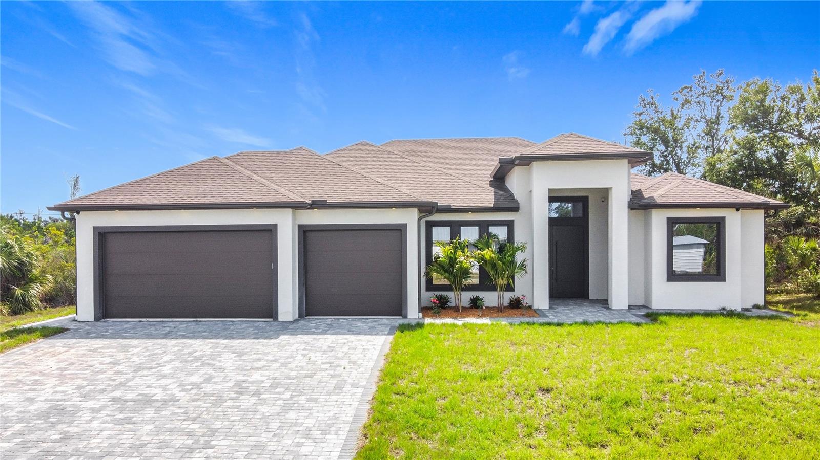This brand new luxury 3 bedroom, 3-bathroom and a 3 car garage house, is a single-family home that encompasses 2,150 sq. of open living space with high ceilings. The kitchen has upgraded granite countertops with large counter island, along with a corner pantry and plenty of cabinet space. The Master Bedroom includes his and hers oversized walk-in closet with build in shelves, separate sink vanities, enormous wall-to-wall walk-in shower and private water closet, and oversize free standing bath tub. Guest bedroom with its own ensuite bathroom, build in closet shelves. Ecofriendly, surround with security cameras, HURRICANE PROOF WINDOWS AND DOORS, sound isolation from outside noise, HEATED POOL WITH SPA, and cage enclosed. GARAGE FLOORS COVERED EXPOXY.