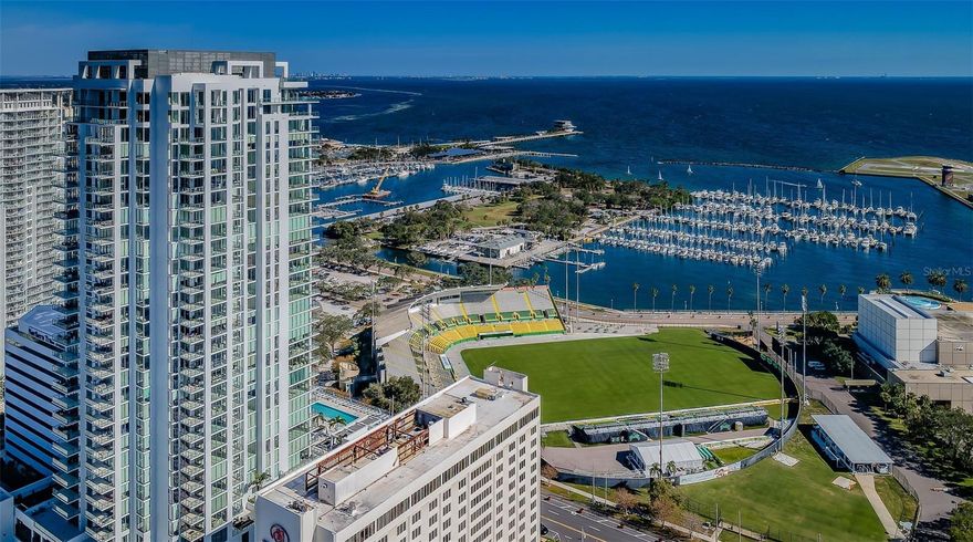 SOARING HIGH ABOVE DOWNTOWN ST. PETERSBURG WITH SPECTACULAR VIEWS OF TAMPA BAY, THE PIER, THE MARINA AND DEMENS LANDING, THIS DAZZLING 30TH FLOOR RESIDENCE DELIVERS AN INSPIRING COASTAL CONTEMPORARY APPEAL! Step inside and take in a sophisticated and uniquely cosmopolitan living experience with sublime finishes, and a striking cultured ambiance that confirms, “this is home.” Scores of updates and upgrades include luxury fixtures, customized designer lighting, specialty wall treatments, upgraded porcelain floors, and well-concealed electronic shades. Your entryway opens to an impressive great room plan with sweeping, captivating views of the downtown waterfront. An eye-catching chef’s kitchen boasts an elegant minimalistic cabinetry design, exquisite quartz surfaces, an exceptional luxury appliance package, fine center island breakfast bar, a splendid dry bar with a luxury wine/beverage chiller, extensive storage, and a wonderful herringbone-pattern marble backsplash. Living area features a gorgeous custom entertainment wall, 10ft-high floor-to-ceiling window views and access to two covered balconies. The posh owner’s suite enjoys stunning views of the downtown waterfront, private access to plush covered balcony, and two sizable walk-in closets with closet systems. The owner’s bath is a lavish, pampering experience with gorgeous vanities, superior fixtures, custom designer tilework, new LED mirrors, a sumptuous built-in soaking tub and a terrific oversized walk-in glass shower enclosure. The second bedroom suite with walk-in closet and graceful full bath, has exceptional in-town views and private access to a superb covered balcony. The beautiful den/office makes for a fine 3rd bedroom and is supported by a richly-appointed full guest bath. You’ll appreciate the exceptional laundry room with plenty of storage, built-in wash tub, quartz counters and lovely cabinetry. Saltaire’s world-class amenities seamlessly blend with your business, pleasure, social and fitness requirements. The grand 7th floor open deck with swimming pool/spa and lounging/grilling facilities provides direct open views of Tampa Bay and the St. Pete downtown waterfront. Full-service/state-of-the-art fitness center, social/dining room with beautiful luxury kitchen, numerous indoor lounging areas, executive conference facility, ‘café,’ dog park and so much more. Frequently recognized as the Gulf Coast’s most vibrant coastal downtown area, downtown St. Pete offers outstanding dining, shopping and entertainment within a short, easy walking distance. From Straub Park to the Mahaffey Theater, from Rowdies Soccer to the Dali, Chihuly and Fine Arts Museums – Saltaire is a remarkable place from which to live, work and play.