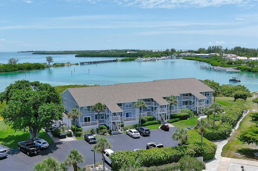 Experience the ultimate island lifestyle in this beautifully furnished and fully updated 2-bedroom, 2-bath coastal retreat—complete with private deeded boat slip #4 featuring a 13K lift with electric and water. Thoughtfully designed with both comfort and sophistication in mind, with stunning views of the Gasparilla Sound and partial views of the Gulf.  Whether you are looking for your own private residence or investment property - this unit can be either or both.  The gorgeous Boca Grande North gated community leads you beautifully onto Gasparilla Island and has been fully updated and renovated.  
Step inside this home featuring a bright and airy open-concept living space, where natural light pours through expansive sliding doors and highlights the home’s stylish finishes. The updated kitchen offers cabinetry lighting, generous counter space and flows into the spacious dining and living areas—perfect for relaxed evenings or hosting friends after a day on the water. The expanded Florida room invites you to enjoy morning coffee, island breezes, or vibrant sunset views overlooking tranquil waters and lush tropical surroundings.  This property was taken down to the studs with all-new electrical, premium materials and living spaces redesigned.

Both bedrooms provide peaceful sanctuaries, each with its own set of sliding glass doors that open to private decking—ideal for stepping outside to enjoy the quiet morning air or unwinding beneath the stars. The primary suite is exceptionally appointed with ample closet space, an in-unit laundry area for added convenience, and a beautifully en-suite bath featuring double sinks and a spacious walk-in shower. The guest bedroom is equally welcoming, with easy access to its own private outdoor space.   The beautifully upgraded guest bath offers a walk-in shower.  Have furry friends? As an owner, you can bring them too!

Beyond the residence itself, the community offers an impressive array of amenities designed to enhance every aspect of island living. Enjoy a refreshing dip in the heated pool, relax in the hot tub, or gather with friends at the clubhouse. Stay active with tennis and pickleball courts, a well-equipped fitness center, and lighted walking paths that wind through the property’s gorgeous tropical landscaping. Additional conveniences include a golf cart charging station, BBQ grills for easy outdoor dining, and serene common areas perfect for relaxing after a day of island exploration. This unit features an outdoor storage closet and access to dockage.

With your own boat slip just steps away, world-class boating, fishing, kayaking, and Gulf adventures are effortlessly accessible. Located along the Boca Grande Causeway, this condo provides quick access to boutique shopping, waterfront dining, pristine beaches, and the charming village of Boca Grande.  The Boat Slip is deeded, dock is with composite material, and you do not need to be a Boca Grande North condominium owner to purchase - makes for a great investment if you want to later sell separately! Deepwater with no bridges and only minutes to the ICW and Gulf!
Whether you're seeking a worry-free vacation home or a full-time island retreat, this residence embodies the carefree, sun-soaked lifestyle that only Boca Grande can offer—your personal slice of paradise awaits.  6000 Boca Grande Causeway, Unit D40
Community buildings feature new roofs, siding, impact windows, spray insulation, and other upgrades.  *More photos coming soon