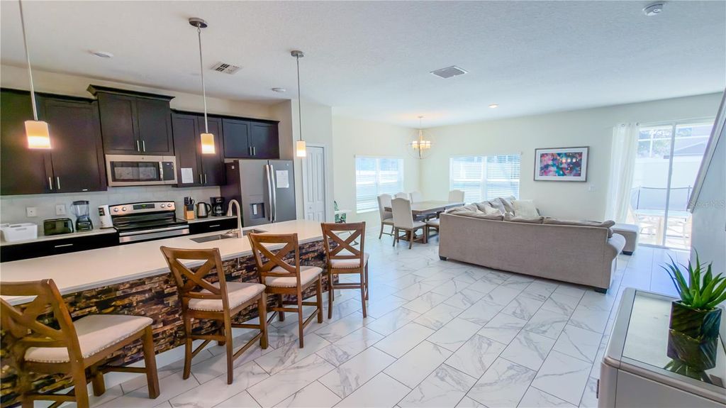 Photo of 444 Ocean Course Avenue, Davenport, FL 33896 (MLS # O6355748)