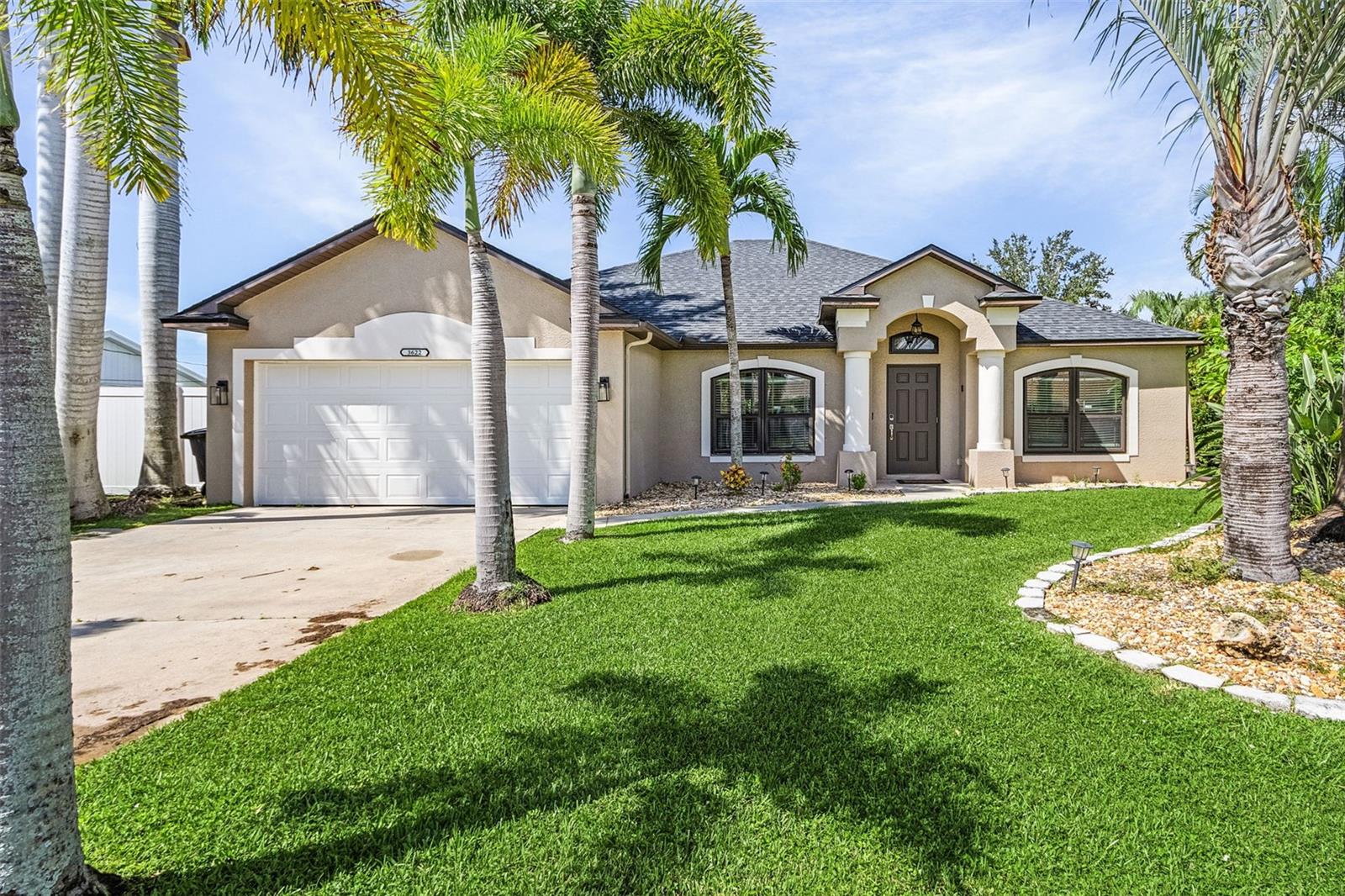 UPDATED HEATED POOL HOME IN SW CAPE - Over $80k in recent upgrades! This wonderful home boasts 4 bedrooms, PLUS a large office/den/flex room, and 2 bathrooms, offering spacious comfort for all your needs. With over 2,100 square feet under air and even more covered lanai seating and kitchen space. This property provides ample space for relaxation and entertainment. As you enter, you're greeted by expansive cathedral ceilings, the warmth of new LVP flooring, fresh paint, and modern style. Step outside into your private retreat where you can unwind under the cover of your expansive outdoor kitchen and where the sparkling blue pool awaits, inviting you to unwind and enjoy the Florida sunshine. Additionally, the landscaping has been completely revitalized. There are lush landscaping plants and palm trees everywhere creating a picturesque setting to relax and entertain. New roof in 2022, New HVAC system in 2022, New pool heater in 2022, New salt system for pool in 2023. You can’t beat this location, close to everything that SW FL has -- BEAUTIFUL sandy beaches, dining, shopping and so much more! If renting is desired, there is already over $38k in rental income booked for the 24/25 winter season!