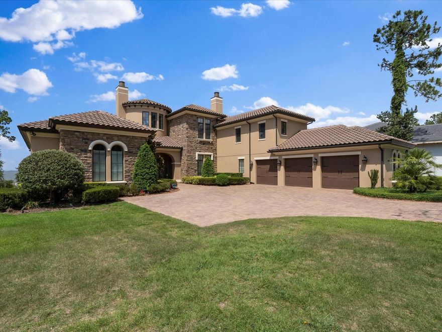 This magnificent custom-built property completed in 2017 offers a luxurious living experience with its impressive features, & boat dock. It's situated on a premium lot of 1.06 acres with panoramic views of Lake Apopka. With a total of 5 bedrooms, 5 bathrooms & 2 half baths, including 2 master bedrooms. Both master bedrooms have stunning lake views, walk-in closets, and spacious en-suite bathrooms. The entryway of the house is turreted, adding a touch of architectural elegance and offering beautiful water views. The living room and formal dining room feature pillared entries, providing a sense of distinction and sophistication. The living room also showcases water views and a lighted cove ceiling. The kitchen is a chef's dream, equipped with top-of-the-line Wolf and Subzero appliances. Upgraded cabinetry and travertine tile flooring add to the overall luxury. The granite island includes a drinking filtration system, ensuring convenience and quality. The first floor master suite is exceptional, with wooden floors, large walk in closets, stand alone tub, large shower, double vanities and built in dressing table, ensuring the height of luxury for any owner. This property offers various amenities for relaxation and entertainment. A gym with a sauna provides the perfect space for exercise and rejuvenation. An office is available for those who require a dedicated workspace. Additionally, an upstairs pub room with a bar offers a great space for entertainment. The house is equipped with an elevator for easy access between floors. Upstairs, you'll find three additional bedrooms, each with its own bathroom. A balcony overlooks the picturesque lake, providing a tranquil spot to enjoy the surroundings. The pool area is truly a resort-style oasis, featuring a large custom pool, a hot tub, and decorative fire bowls. An electronic screened lanai provides an ideal space for relaxation and offers views of the pool and lake. Adjacent to the lanai is a summer kitchen, perfect for outdoor dining, and an outdoor fireplace for cozy evenings.The house is equipped with an internal and external sound system, allowing you to enjoy music and enhance the ambiance inside out outside the property. A 300-foot dock with a boat lift and boat house offers direct access to the lake, providing opportunities for boating and water activities. Comfort and convenience are prioritized with the inclusion of a bug misting system, both at the front and rear of the property, ensuring a pleasant outdoor experience throughout the year. New A/C installed this year. Additional features of the property include a water softening system, crown molding throughout, high ceilings, extra height baseboards, upgraded planting and landscaping, security cameras, gutters, Anderson Series 400 windows for hurricane resistance and heat filtration, an auto power-on natural gas Generac Generator, a 3-car garage with extra storage space, and an extra-long driveway.  The property is located in the prestigious Bella Collina community, known for its beautiful surroundings and amenities. The community features a Nick Faldo designed golf course, a Tuscan-inspired clubhouse with two exceptional restaurants, a gym, a communal pool, tennis courts, and a variety of family events.

Owner occupied so please give 24 hours notice to view. Room Feature: Linen Closet In Bath (Primary Bedroom).