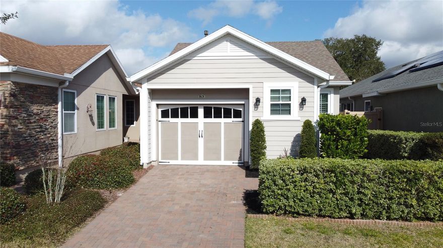 Charming, Pristine, and deceptively spacious, this gently lived-in open-concept home is nestled on a mature tree-lined street and offers designer finishes, energy efficiency, and a fully fenced yard. Inviting curb appeal includes a
paver driveway and walkway, screened rear lanai, and an extensive paved side yard ideal for relaxing or entertaining. Inside, enjoy a light-filled interior with crown molding, plantation shutters, a built-in workstation, and an upgraded
kitchen featuring a large center island, granite countertops, ample cabinetry, pantry, natural gas cooking, and all appliances included. The spacious primary suite offers a walk-in shower with a built-in bench, dual sinks with
granite counters, private toilet area, and a custom walk-in closet. A private secondary bedroom includes two Murphy beds for flexible guest space, complemented by a well-appointed guest bath. Additional highlights
include a two-car tandem garage with extensive storage, front-load washer and dryer, and a paid-off Tesla solar system with transferable warranty, plus natural gas heat, tankless water heater, and gas dryer for long-term
savings. Offered furnished or move-in ready, this home delivers comfort, efficiency, storage, and style in one exceptional package. Community Perks: This guard-gated, resort-style community offers more than just home,
it delivers a lifestyle! The HOA covers cable, high-speed internet, security monitoring, and landscaping/ lawn care so you can focus on enjoying your time. At the heart of it all is the spectacular 57,000 sq ft Magnolia
House, where you’ll enjoy Member-exclusive restaurant and bar with live entertainment. Indoor/outdoor heated pools & a state-of-the-art athletic club Artisan studio, poker room, culinary kitchen, and creative spaces.
Sports courts for tennis, pickleball, bocce, billiards & virtual golf,50+ active, member-led clubs for every hobby and interest. A show-stopping Event Center with a stage and professional AV setup. This isn’t just a home, it’s
a lifestyle upgrade where you’ll find connection, wellness, excitement, and belonging every day. Conveniently located 45 minutes to Theme Parks including Universal and Disney World and Orlando International Airport, 1
½ hour to Beaches and Port Canaveral Cruise Terminal. This isn’t just a home — it’s a lifestyle upgrade. Live your BEST LIFE at Trilogy!