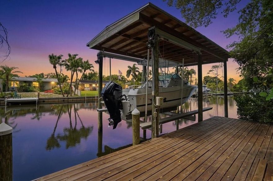 Tucked within the gated waterfront community of Placido Bayou, this custom waterfront residence offers a rare combination of privacy, flexible living, and direct boating access in one of St. Petersburg’s most sought-after neighborhoods. One of the few homes in the community with its own private dock, covered lift, and canal access, the property invites a true Florida lifestyle where boating, paddleboarding, and sunset cruises begin just beyond your backyard.

A limited, private preview opportunity will be held Saturday May 16 from 1 to 3. Buyers are encouraged to contact the listing agent for preview details and private access

Designed around the resort-style pool and outdoor living spaces, the home blends indoor and outdoor living with walls of glass, soaring ceilings, and expansive gathering areas that feel both open and inviting. Natural light pours through the living spaces while tropical landscaping creates a peaceful sense of seclusion rarely found in waterfront homes.

The kitchen was designed for entertaining on a grand scale, featuring extensive workspace, custom cabinetry, professional-grade appliances, wine refrigeration, and seamless flow into multiple living and dining areas. A separate game and entertainment room with wet bar opens directly to the pool area, creating the ideal setting for hosting family and friends year-round.

The layout offers exceptional flexibility, including dual primary suites with private baths, creating comfortable accommodations for guests, multigenerational living, or a luxurious upstairs retreat. The main primary suite opens directly to the pool and features generous proportions, abundant natural light, and a spacious spa-like bath.

Outside, the covered lanai, pool and spa, waterfront deck, and private dock create an atmosphere that feels more like a private resort than a traditional neighborhood home. All of this is set behind the gates of Placido Bayou, just minutes from vibrant downtown St. Petersburg, waterfront parks, dining, shopping, and Tampa Bay’s award-winning beaches, with close proximity to Shorecrest Preparatory School.

Rarely do homes offering this level of privacy, waterfront lifestyle, and boating access become available in Placido Bayou. Schedule your private showing and experience one of the community’s most unique waterfront opportunities firsthand.