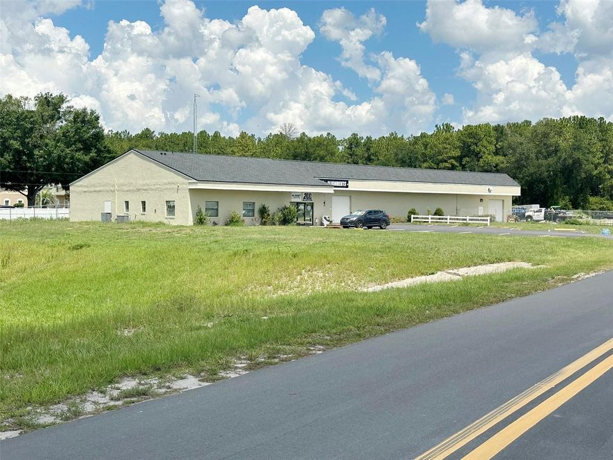 Versatile 11,112 SF concrete block building offering Class A office/showroom space with large warehouse area located on a .90-acre parcel. There is an additional covered canopy area (approx 1,000 SF) as well for additional storage needs. Zoned B-5 and positioned in desirable SW Ocala with close proximity to high-traffic residential areas and high rooftop count. Features include 4 roll-up doors, true covered work area with power, LED warehouse lighting, kitchenette, well, septic (city water/sewer available), and 12 parking spaces. Interior layout includes 6 private offices, reception, waiting area, conference room, and 4 restrooms—one with full shower off executive office and one in the warehouse. Recent upgrades: new roof, new interior/exterior paint, and new toilets and sinks. Ideal for a wide range of business uses.