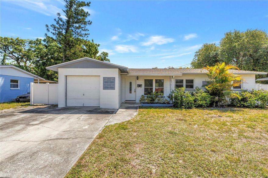 Situated in the desirable Meadowlawn neighborhood, this move-in ready home offers comfort, updates, and exceptional value—all in one package. Enjoy peace of mind with major improvements already completed: NEW roof (2025), HVAC (2023), Hurricane rated, double pane windows and freshly professionally painted interior (2026). Inside, the home features an open-concept floor plan ideal for today’s lifestyle, with the living and dining areas flowing seamlessly into a modern kitchen appointed with quartz countertops, newer appliances, and wood cabinetry. A spacious bonus family room at the rear of the home provides a cozy second living area—perfect for relaxing or entertaining—and opens directly to the backyard, creating effortless indoor-outdoor flow. The bedrooms are privately tucked away down a quiet hallway, along with a generously sized full bathroom featuring an oversized vanity. Tile flooring throughout adds durability, style, and easy maintenance. Step outside to an oversized 75' x 100' fully fenced lot, offering endless possibilities—room for a pool, garden, or outdoor entertaining space. A double gate provides secure storage for a boat or trailer, and the extended driveway allows for ample off-street parking. A shed provides the added storage needed for yard tools or personal items. The attached one-car garage includes a dedicated laundry area for added convenience. Additional highlights: No history of flooding and no impact from the 2024 storm season, Low flood insurance premiums, Solid construction and well-maintained condition. Conveniently located near parks, shopping, dining, and just a short drive to downtown St. Petersburg and the waterfront, this home is ideal for buyers seeking space, updates, and flexibility at an attractive price point. While located on 16th Street, this section is uniquely positioned where the road slows and transitions into the neighborhood, offering a quieter setting than expected. Don’t miss this opportunity—homes with this combination of upgrades, lot size, and functionality are hard to find!