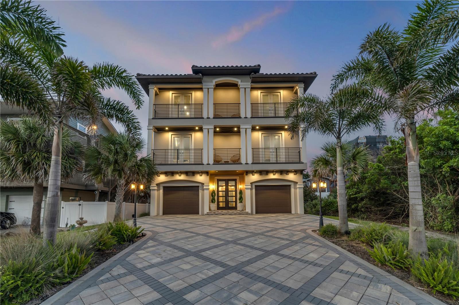 Spectacular 4-bedroom, 3-bath custom home in highly sought-after Bethune Beach, just steps from the sandy shoreline and directly across Welcome to this spectacular coastal retreat in the heart of sought-after Bethune Beach, just steps from the sandy shoreline and directly across from the beloved locals spot, JB’s Fish Camp. Built in 2022 and offering nearly 3,200 square feet of thoughtfully designed living space, this exceptional 4-bedroom, 3-bath home is perfectly positioned to capture breathtaking panoramic views of both the Atlantic Ocean and the Intracoastal Waterway. Enjoy easy access across all levels with a 4-stop elevator, and take in the beauty of your surroundings from expansive East and West balconies or the spectacular rooftop deck—ideal for savoring unforgettable sunrises and sunsets over the water. The gourmet kitchen is a true showpiece, featuring custom maple cabinetry, luxurious Tahiti marble countertops, a 6-burner KitchenAid gas range, built-in refrigerator, ice maker, and an oversized granite topped island that’s perfect for entertaining family and friends. Inside, you’ll find beautiful bamboo floors, a stylish wet bar, a cozy electric fireplace, and spa-inspired bathrooms equipped with Delta multi-jet showers for the ultimate in relaxation. Step outside and unwind in your private 7-person hot tub after a day at the beach. Built with strength and longevity in mind, this home features a 16-piling foundation, hurricane-impact doors and windows, closed-cell spray foam insulation, foam-glued roof tiles, and an owned 250-gallon propane tank, ensuring durability and peace of mind. Additional highlights include a 2-car garage, EV charging station, Ring security system, and much more. Just minutes to the pristine Canaveral National Seashore, this is truly coastal living at its finest—whether you’re looking for a full-time residence, a luxury vacation home, or an incredible investment opportunity.