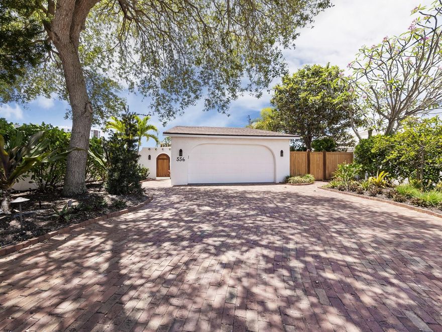 Welcome to 556 North Washington Drive, a captivating waterfront oasis nestled between the pristine sands of Lido Key and the enchanting allure of St. Armands Circle. This prime location offers a unique blend of serene waterfront living and convenient access to top-tier shopping and dining options. This meticulously updated residence boasts three bedrooms and three bathrooms, ensuring ample space for family, guests, or a home office. The property features a new dock and seawall, complemented by impact-resistant windows that enhance both safety and energy efficiency. The heart of the home is adorned with an updated kitchen and baths, marrying modern amenities with timeless charm.

The two-car garage includes a loft, providing additional space for storage or potential expansion. The home's split living plan includes a separate entrance, offering flexibility for diverse living arrangements.

Outdoor living is redefined here, with a private dock where you can enjoy watching manatees play, throw a line and catch dinner, or watch breathtaking sunsets. The property's location on a wide boating canal opens up endless possibilities for water activities right from your backyard. Whether it's fishing, kayaking through the tranquil lagoon, or cruising to the open bay, this home invites you to embrace the waterfront lifestyle.

The tropical courtyard pool area offers privacy for swimming or alfresco dining. Just steps away from the vibrant scene of St. Armands, with easy access to downtown and Longboat Key, for easy access to theater, 5-star dining, and all of the cultural activities Sarasota has to offer.  Available furnished and move in finished, a beachside alternative to condo living, this residence is more than just a home—it's an exquisite retreat in a coveted locale.