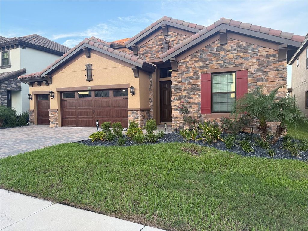 Photo of 10958 Rustic Timber Loop, San Antonio, FL 33576 (MLS # TB8473496)