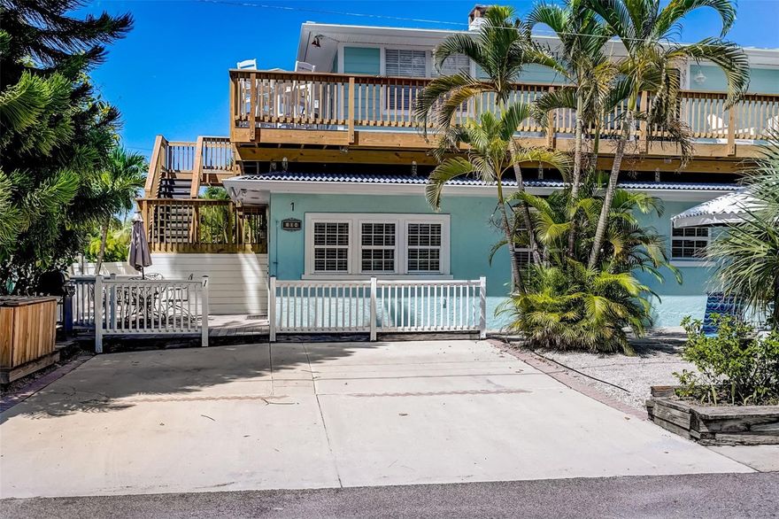 Relax on your Deck that looks out to the view of the Gulf -beach. Main floor beach living. Located on a very quiet street across the street from the beach. This newly remodeled sophisticated and chic but still cozy beach cottage has plenty of natural light that fills each room. Features 3 nice sized bedrooms, PLUS A SMALL DEN AREA  & 2 full baths. 2 bedrooms with king beds and 3rd bedroom with bunk beds and a 3rd single bed.  Relax under one of your large tiki's or have a drink on your private deck either in front with a beach view or back areas of the owners suite. or maybe just spend all day at the beach. The location is close to everything. Either walk or ride your bike or take the free island trolly to all the local area restaurants, Bars, shops or attractions. Updates include: Newly updated kitchen & baths, freshly painted interior with new furnishings. Authentic Mexican Tile flooring. Newer stainless appliances. Just completed :Newly painted exterior of the building and redone decks on building. Parking for 2 large cars. The location is such a dream only a few steps to the beach. Please view the 360 walk through- interactive tour and the drone video of the location. You will not find another sophisticated and chic beach space with the perfect designers touch's this close to the beach. Excellent rental history with all 5 star reviews.