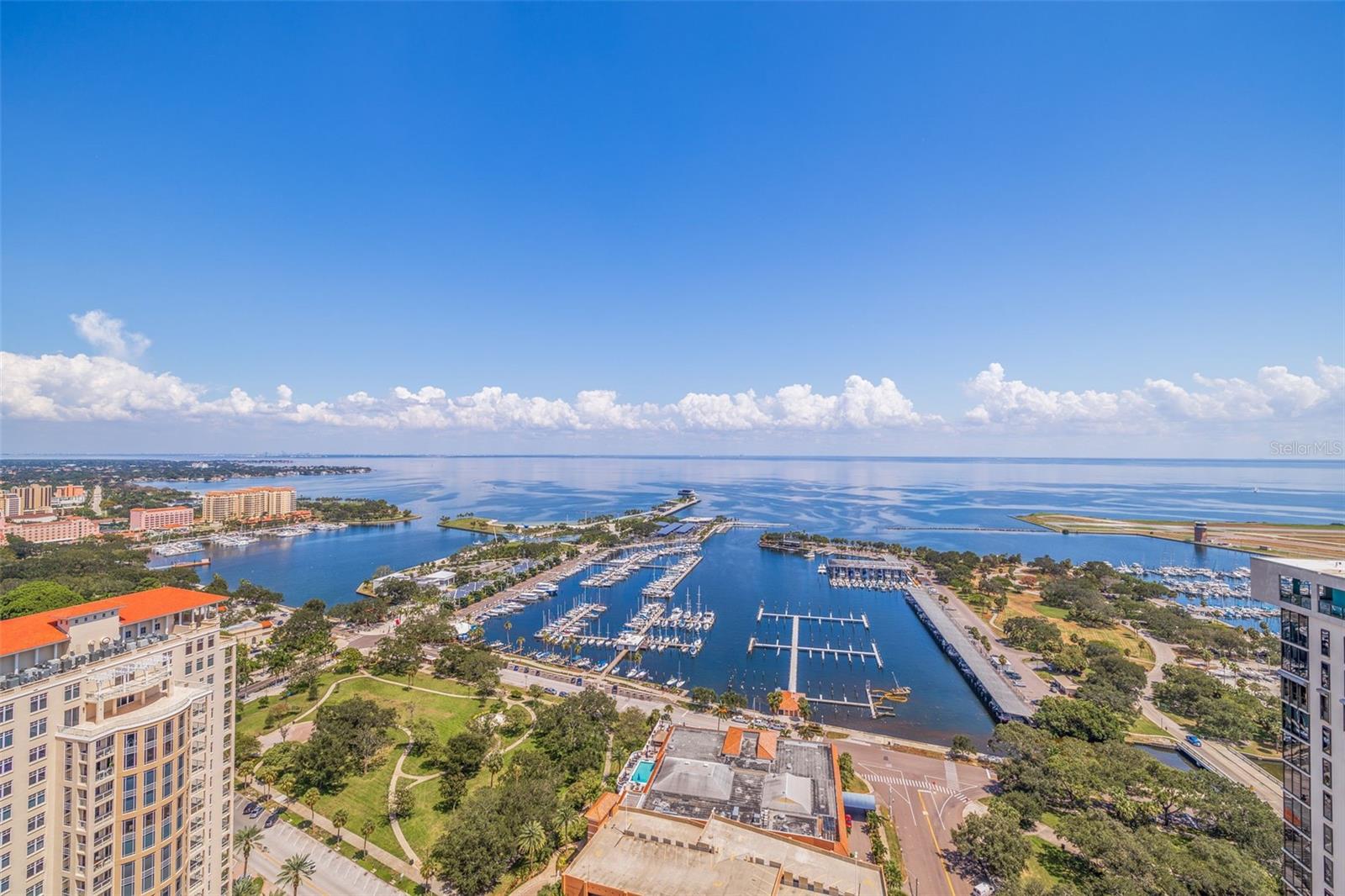 Experience the epitome of Downtown Luxury Living in this stunning Condo in one of the most sought after buildings in downtown St Petersburg at The One! Enjoy astonishing unobstructed views of Tampa Bay all the way to the Tampa skyline. The open floor plan, 10ft ceilings, floor to ceiling windows and full size sliding doors leading from the great room to the expansive balcony make this the perfect space for entertaining or relaxing. European cabinetry and stone counter tops, paired with custom finishes throughout create the perfect blend of sophistication with hints of a bright beachy feel. The primary bedroom hosts a luxurious walk-in California Closet and spacious en suite bathroom with a duel vanity. The 2nd bedroom also boasts California Closet designs, and a full en suite bathroom as well. The den space has been brilliantly adorned with custom storage, a hidden Murphy bed and attached half bath making it an ideal space for an office that can quickly be transformed into an extra bedroom if needed. The amenities include a resort style pool deck, with a 75ft lap pool, cabanas, grills, outdoor kitchen space and a lounge area. Inside there is a game room, club room, social rooms and a library. With a walkability score of 95 St Pete is one of the most walkable cities in the state, and at The One you are living in the heart of it surrounded by countless museums, restaurants, bars, shops, art galleries, waterfront parks, boating and the newly renovated St Pete Pier! The unit as 2 side by parking sport and a sizable storage unit. Call for a showing today!