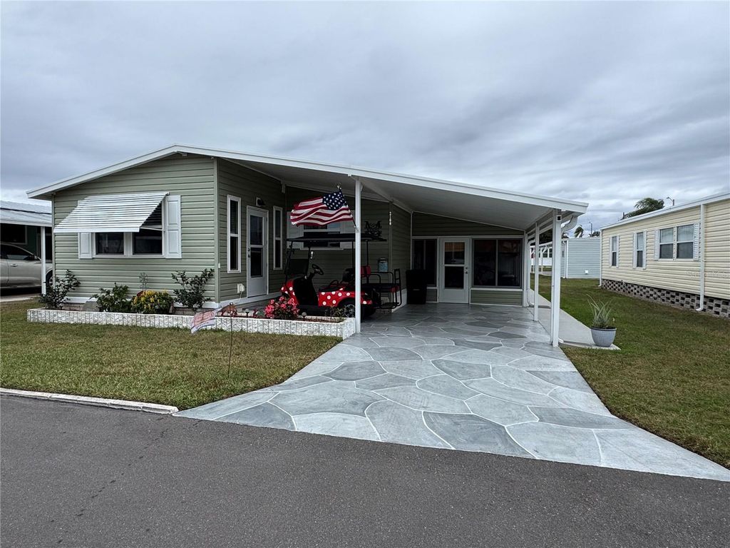 Photo of 2100 Manoa Drive, Holiday, FL 34691 (MLS # W7881746)