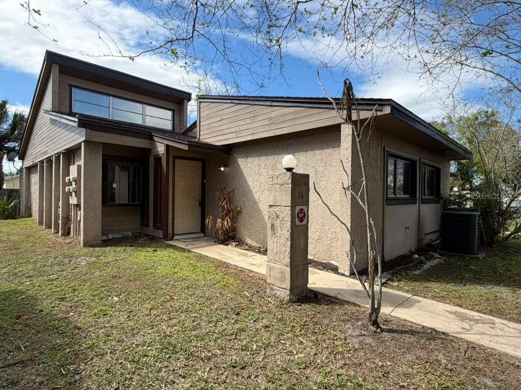 Photo of 118 Dahlia Village Circle #79, Orlando, FL 32807 (MLS # O6388479)