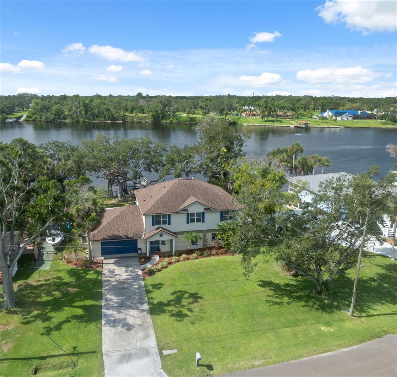 This flexible home can be enjoyed as a spacious single-family residence or as two separate units, perfect for extended family or rental income. The upstairs unit features 3 bedrooms, 2 bathrooms, a cozy fireplace, and a laundry room. The open living area boasts stunning water views of the Alafia River. The downstairs unit has a private entrance, 2 bedrooms, and 2 bathrooms.
The property's best feature is its direct river access, complete with a private boat dock and lift. A two-car garage and ample space for an RV or other recreational vehicles make this home a perfect choice for outdoor enthusiasts. Enjoy the convenience of being close to everything Riverview has to offer, with easy access to major expressways including I-75, the Selmon Expressway, and US-301. This prime location puts you just a short drive from shopping, dining, parks, and entertainment.