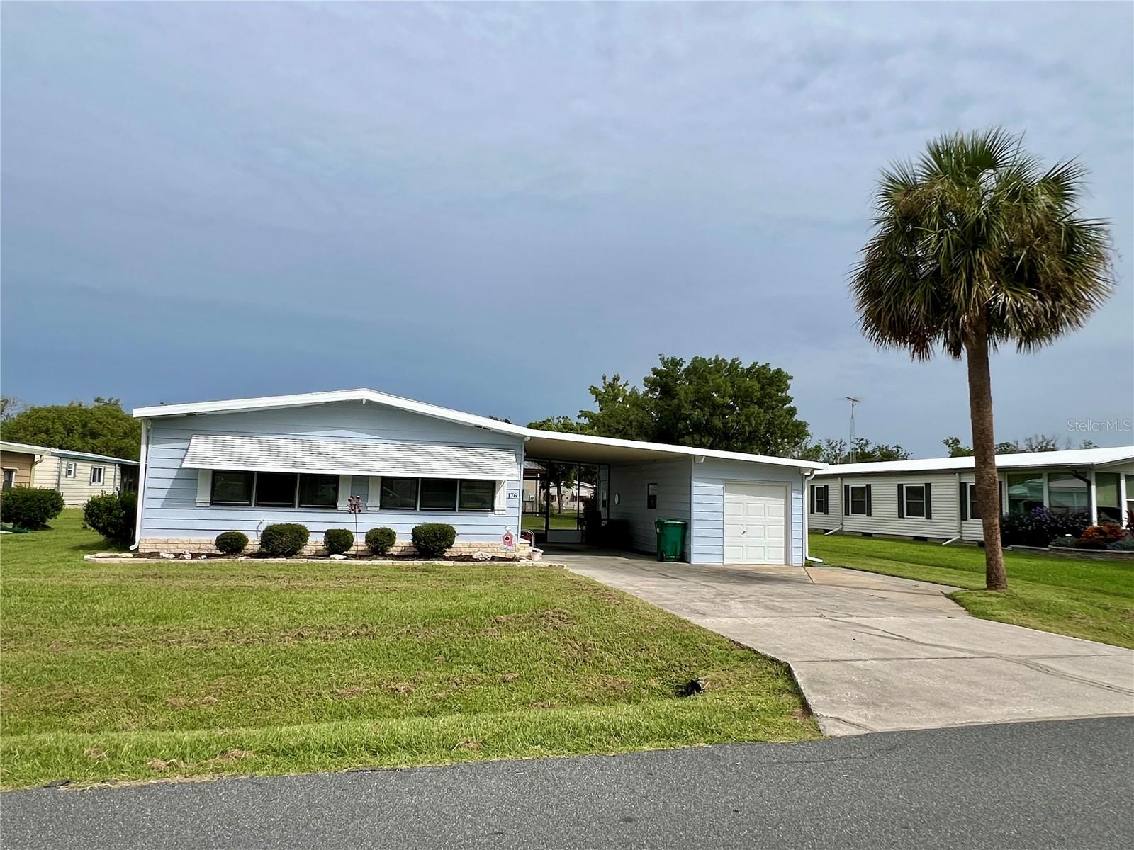 Seller is MOTIVATED, PRICE ADJUSTMENT, COME ON AND TAKE A LOOK, MAKE THIS ONE YOUR HOME TODAY! Welcome to this beautifully refreshed 2 - bedroom, 2-bathroom home located in Phase 1 of a
sought-after, vibrant golf community—just a short walk or golf cart ride to the clubhouse and all
the amazing amenities. With over 1,500 square feet of living space, this spacious home features
a bright open floor plan, brand new flooring throughout, and fresh interior paint that gives it a
crisp, modern feel. The oversized bedrooms give plenty of room to relax, with generous closet
space for all your storage needs. Light and airy throughout, the home is filled with natural
sunshine, creating a warm and welcoming atmosphere. Recent updates include a new AC unit in 2025,
a membrane roof installed in 2020, newer plumbing in the primary bathroom sinks and shower,
and the home was professionally leveled in 2024. It also comes with a transferable termite bond
for added peace of mind. Home also features a Resident Owner Certificate and Golf Cart too.
Located within a vibrant, active lifestyle community, residents enjoy access to a wide range of
amenities including a championship golf course, on-site restaurant with dancing and live
entertainment, fitness center, gym, exercise classes, pickleball and tennis courts, billiards, a dog
park, woodworking shop, craft room, and so much more. Outdoor lovers will appreciate the
proximity to scenic Lake Okahumpka, perfect for kayaking, fishing, and embracing the natural
beauty of the area. With dozens of social clubs and community events happening regularly, you
will never run out of ways to stay engaged and make new connections. Whether you’re looking
to stay active or simply relax in a peaceful, waterfront setting, this home offers the ideal blend
of comfort, charm, and lifestyle. Don’t miss this opportunity to own a piece of paradise—
schedule your private tour today!