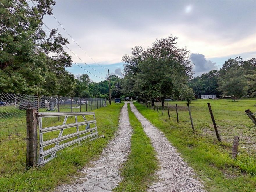 Opportunity Awaits on 2.5 Acres! This expansive property offers endless possibilities for the savvy investor, builder, or visionary buyer. Located on a quiet road with plenty of space to stretch out, this 2.5-acre parcel features a mobile home in need of repair or removal—providing the perfect blank canvas for your next project. Whether you're looking to bring in a new manufactured home, build from the ground up, or create a private homestead, the land is full of potential. Mature trees, natural surroundings, and plenty of open space offer the ideal setting for a rural retreat or investment opportunity. No HOA, plenty of room for toys, animals, or future expansion. With the right touch, this could be the location you've been waiting for. Don't miss your chance to transform this property into something special—schedule your showing today and explore the possibilities!