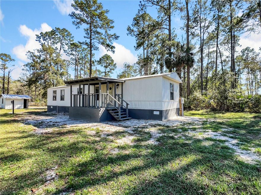 Seller financing available, VA or CASH accepted! Charming 2-bedroom, 2-bathroom 1989 manufactured home on a peaceful, private lot at the end of a quiet street. Located in a serene X Flood Zone area, with the neighboring lot owned by Ocala Forest. Recently updated with luxury vinyl flooring, new toilets, faucets, fresh paint, and an upgraded electrical panel. Enjoy outdoor living with two new decks/porches in front and back. The 2021 water heater adds convenience, and a spacious 14x16 shed provides extra storage. A perfect retreat with beautiful tree views!