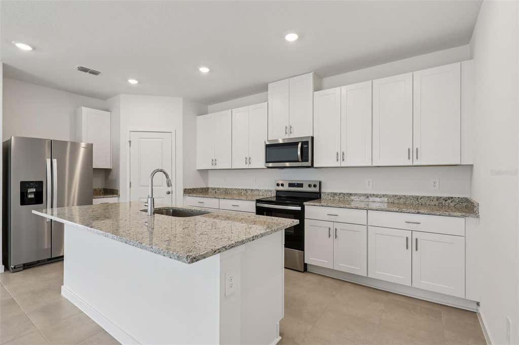 Photo of 81 Wandering Creek Way, Palm Coast, FL 32164 (MLS # TB8541087)
