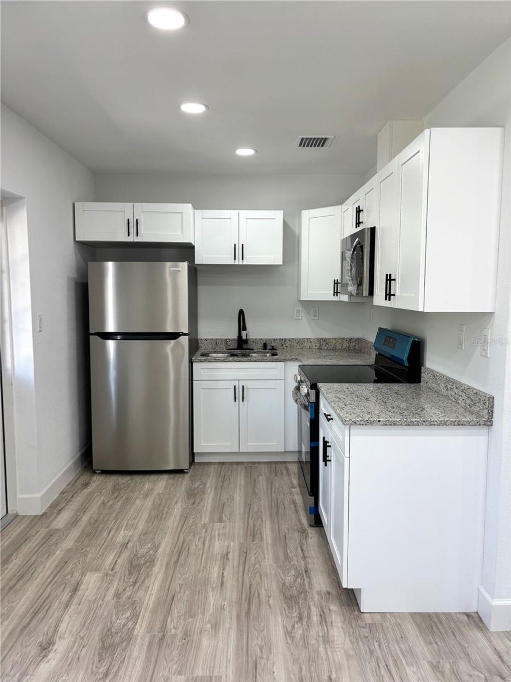 Photo of 1301 Woodbine Street, Clearwater, FL 33755 (MLS # TB8462652)