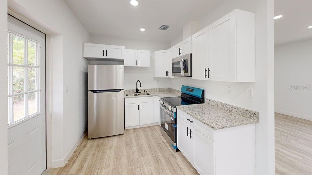 Photo of 1301 Woodbine Street, Clearwater, FL 33755 (MLS # TB8462652)