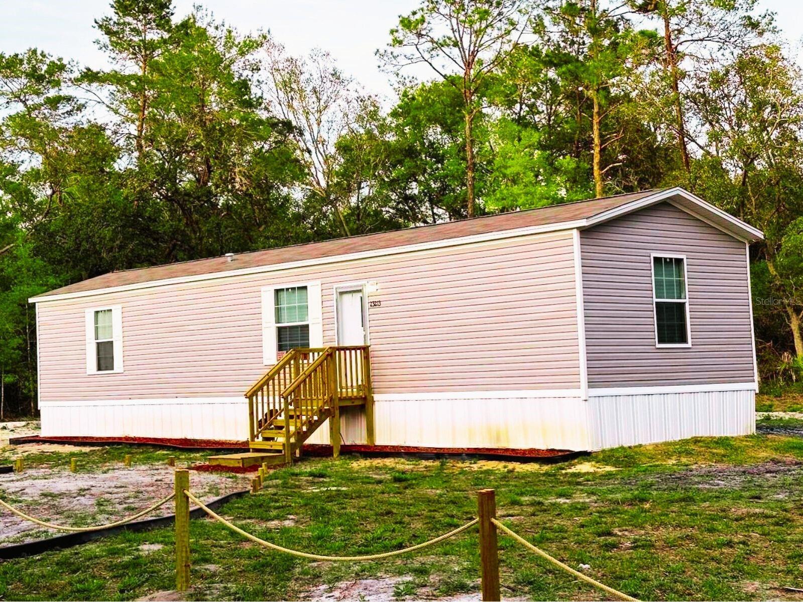 Modern, clean, move-in ready home on almost half an acre. No carpet. No immediate neighbors. Full Financing and Owner Financing available. Two short blocks off a paved road. Like new 2 bedroom, 2 bathroom home offers peace and privacy - this is Central Florida at its best. The neighborhood is mostly wooded and features multiple lakes, including Horseshoe Lake Park. Enjoy the Oklawaha or various activities in the Ocala National Forest or take a drive to Palatka for fishing and shopping, Salt Springs for Lake Kerr and restaurants, Orange Lake for Bass and recreation, or Ocala & Gainesville for everything civilized you might require. Nature abounds in this neighborhood - come, pause, take a deep breath, and listen to the quiet. You may never want to leave.