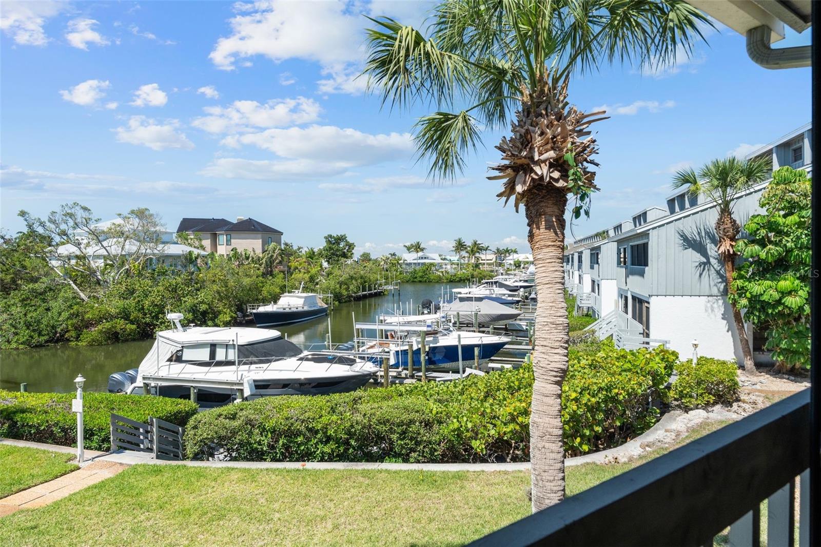 RARELY AVAILABLE THREE BEDROOM THREE BATH WITH 10,000 POUND BOAT LIFT AND SLIP THAT ACCOMMODATES UP TO A 45’ BOAT! Have you heard? Big Pass Is Open! You can now access the open waters of the Gulf from Big Pass, located between south Siesta Key and Casey Key! Enjoy the intracoastal waterway North and South in protected waters. This condo has beautifully updated kitchen and baths, quartz countertops, newer appliances, beautiful flooring throughout and soaring 20’ ceilings. Relax in the glassed and screened lanai overlooking the deep-water boat basin. The second story offers additional living space, a private bedroom and bath and a spacious 12’ x 13’ storage room. Harbour Towne has a clubhouse, pool, spa, four pickleball courts and a tennis court. Enjoy the world-famous Siesta Key Beach right across the street. If you love beach life, boating, pickleball and tennis, this is the condo for you! You may especially like the Siesta Key Village vibe with an easy walk, cycle or free trolley ride to enjoy great restaurants, live music, and shopping. It’s all here for the resort get-away feeling!
