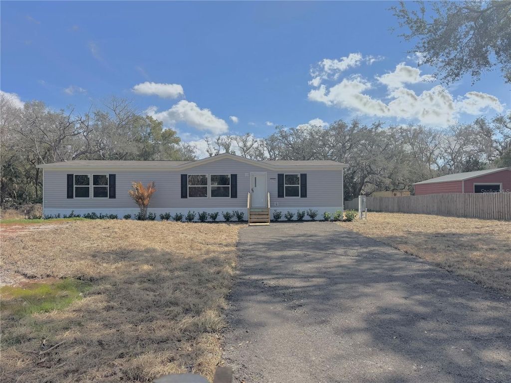 Photo of 12396 Hicks Road, Hudson, FL 34667 (MLS # W7882377)