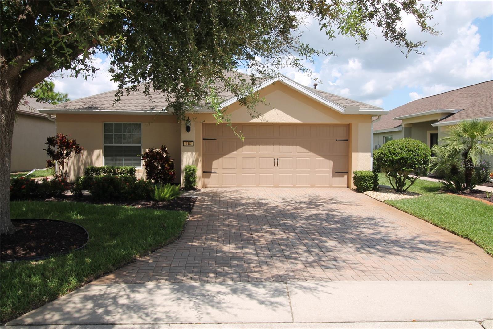 A rare opportunity to own one of only a few homes with the million dollar view on a spectacular lot in beautiful and desirable 55+ gated community of Del Webb Orlando. If you are looking for a primary or secondary home that is not too large or too small this beautifully maintained 1,713 square foot 3-bedroom, 2-bathroom, two car garage is it. Home has a new roof (2 years), exterior/interior painted, recent landscape yard and sealed driveway. You will enjoy many days/nights having your favorite drink overlooking the beautiful golf course and ponds. Del Webb Orlando is known for its resort-style amenities including indoor and outdoor pools, fitness center, walking track, pickle ball, tennis, bocce ball, shuffleboard, and a full-service tavern—all nestled behind the gates with 24-hour security. Plus, you’re just minutes from I-4, Posner Park, hospitals, golf, and the magic of Central Florida’s world-renowned attractions. Plus the newest addition is the Ridgewood Lakes Golf Course Clubhouse has just opened the new "White Heron Nest Restaurant" serving breakfast, lunch and dinner. Food is delicious. This is more than a home, it’s a lifestyle. Don’t miss your chance to own a rare, screened lanai retreat in one of Central Florida’s top 55+ communities.