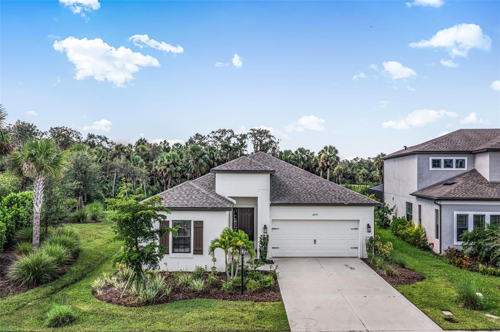 One or more photo(s) has been virtually staged. This move-in ready 4-bedroom plus den, 3-bath home in the desirable Cassia at Skye Ranch community offers the perfect blend of comfort, style, and convenience. The sought-after Antigua floor plan features a spacious single-story design with soaring ceilings and an open concept layout that’s ideal for both everyday living and entertaining. The gourmet kitchen boasts a large center island, granite countertops, stainless steel GE appliances, a walk-in pantry, and a gas cooktop. The versatile den is perfect for a home office, hobby space, or playroom. New carpet has just been installed in all bedrooms and the flex room. The light-filled living area flows seamlessly to the covered lanai, where you’ll enjoy peaceful, private views of the lush greenbelt and walking path behind the home. Residents of Skye Ranch have access to an impressive array of amenities at The HUB, including a resort-style pool and spa, Junior Olympic pool, splash pad, locker rooms, fitness and movement studios, basketball court, rock climbing wall, demonstration kitchen, and café. Outdoor recreation abounds with nature trails, dog parks, playgrounds, sports fields, sand volleyball, tennis, pickleball, and a community firepit area. A brand-new K–8 school is under construction right in the neighborhood. Conveniently located east of I-75, this home is close to top-rated schools, shopping, dining, healthcare, cultural attractions, and only 25 minutes to world-renowned Siesta Key Beach. **THIS PROPERTY QUALIFIES FOR A 1% LENDER INCENTIVE IF USING PREFERRED LENDER. INQUIRE FOR MORE DETAILS.**